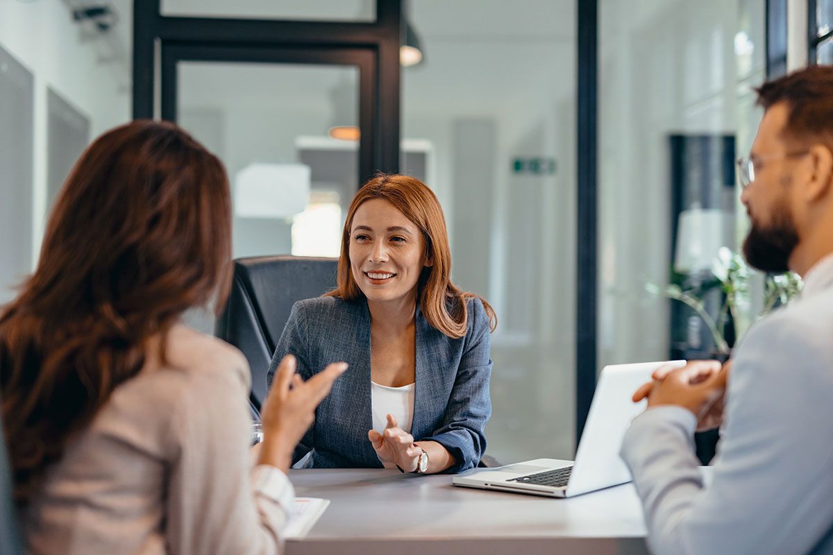 Banking adviser meeting a client in a bright office