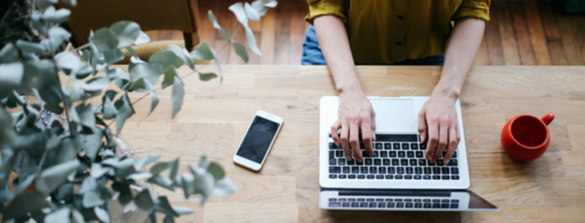 Woman reviewing campaign performance on a laptop