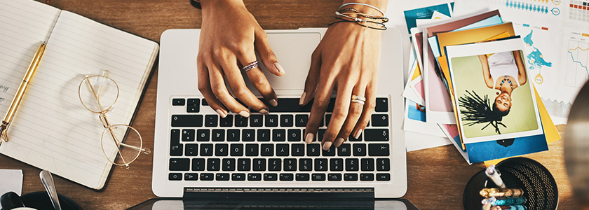 Designer working on a website layout on a laptop