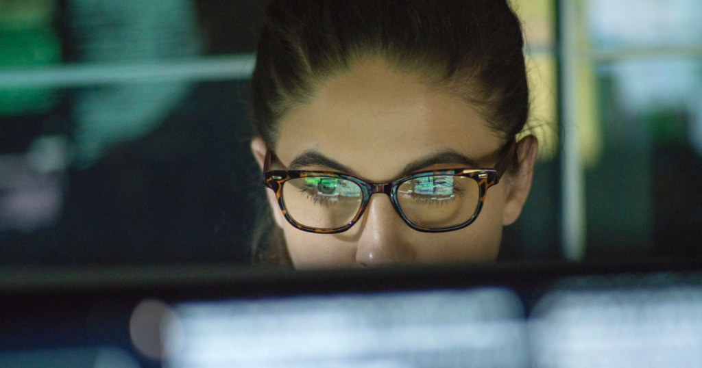 User focused on digital screen, representing online behaviour analysis