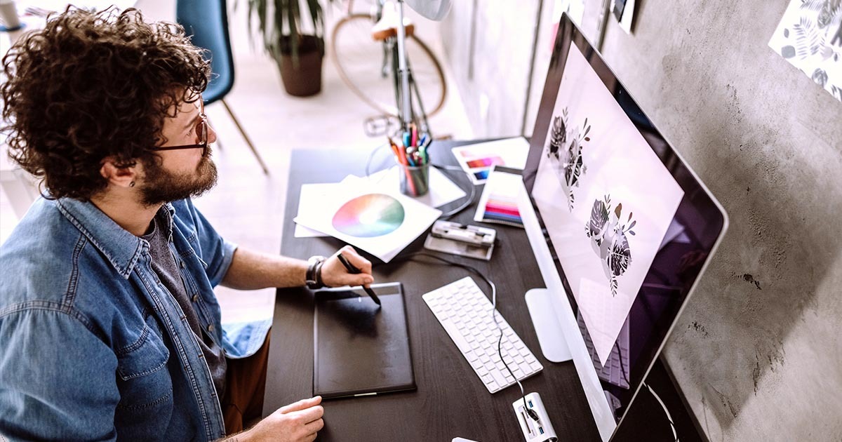 Someone designing graphic digital content on computer