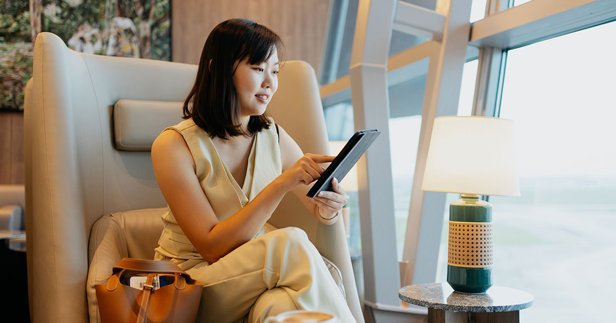 Glamourous Woman shopping Luxury Brands on a tablet